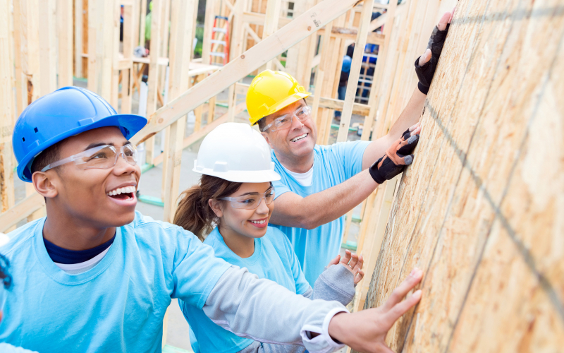 Volunteers helping to build a home