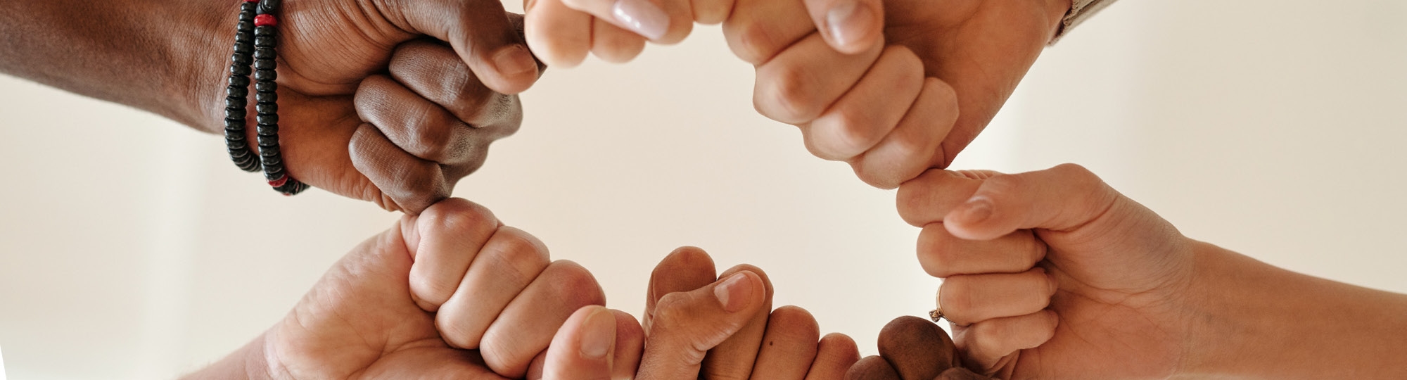 Fists together forming a circle